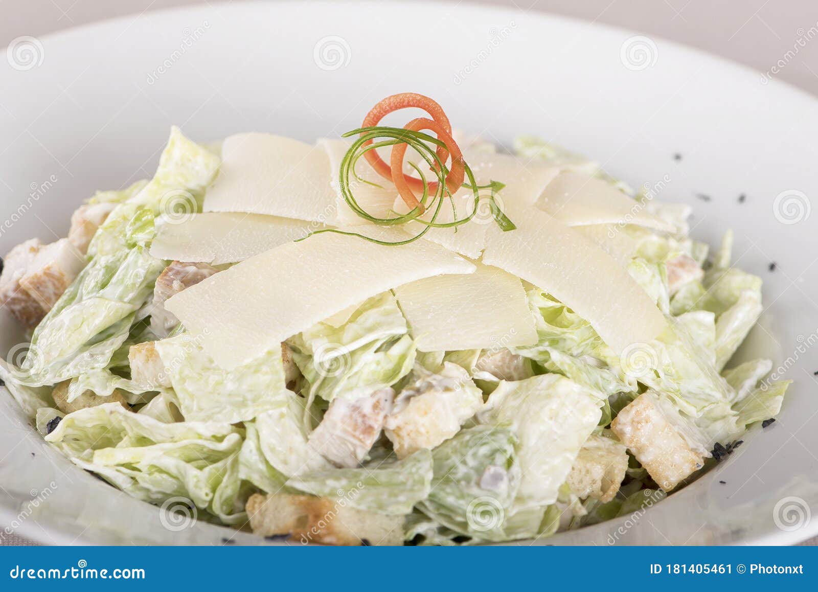 caeser salad with chicken fillet,  white plate,  brown background