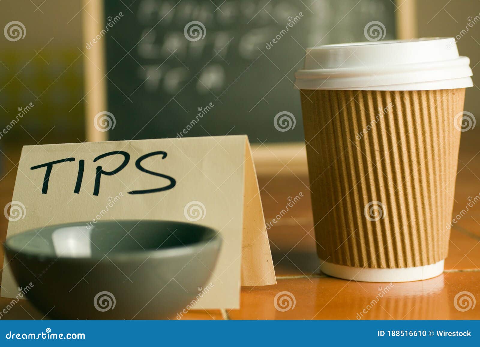 cafe counter with coffee cup, prices and tip box