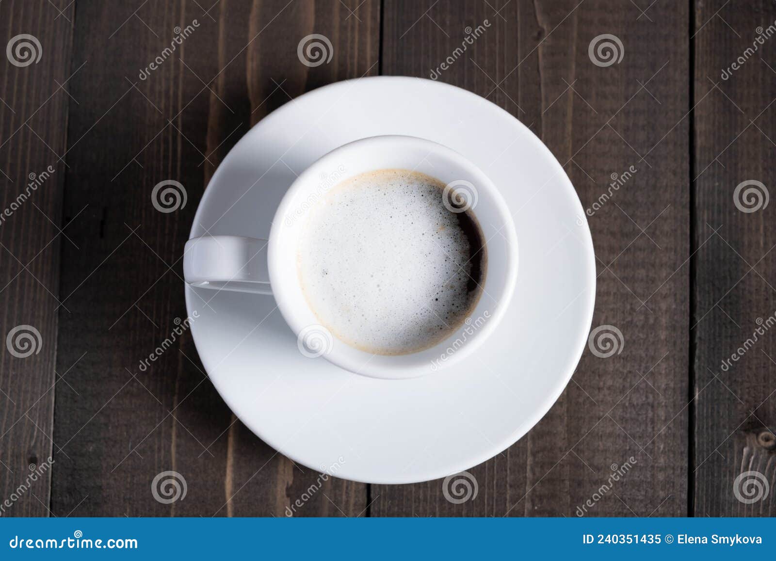 cafe espresso macchiato layered coffee in a see through white glass coffee cup