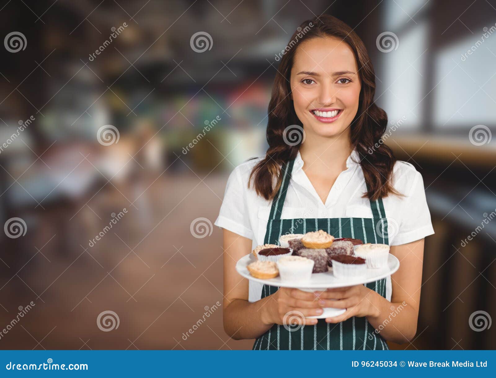 Cafe Owner Holding Cupcakes Against Blurry Cafe Stock Photo Image of female, business 96245034