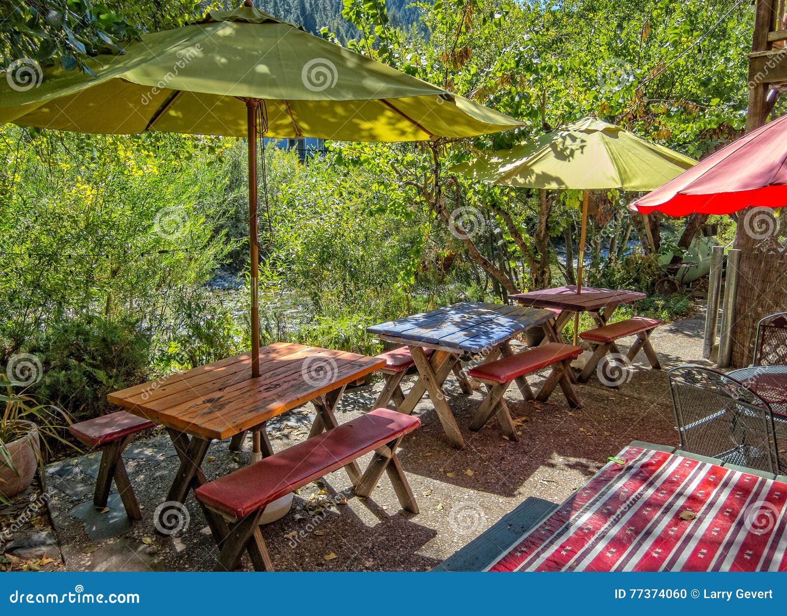 Cafe seating by the river stock photo. Image of cafe 77374060