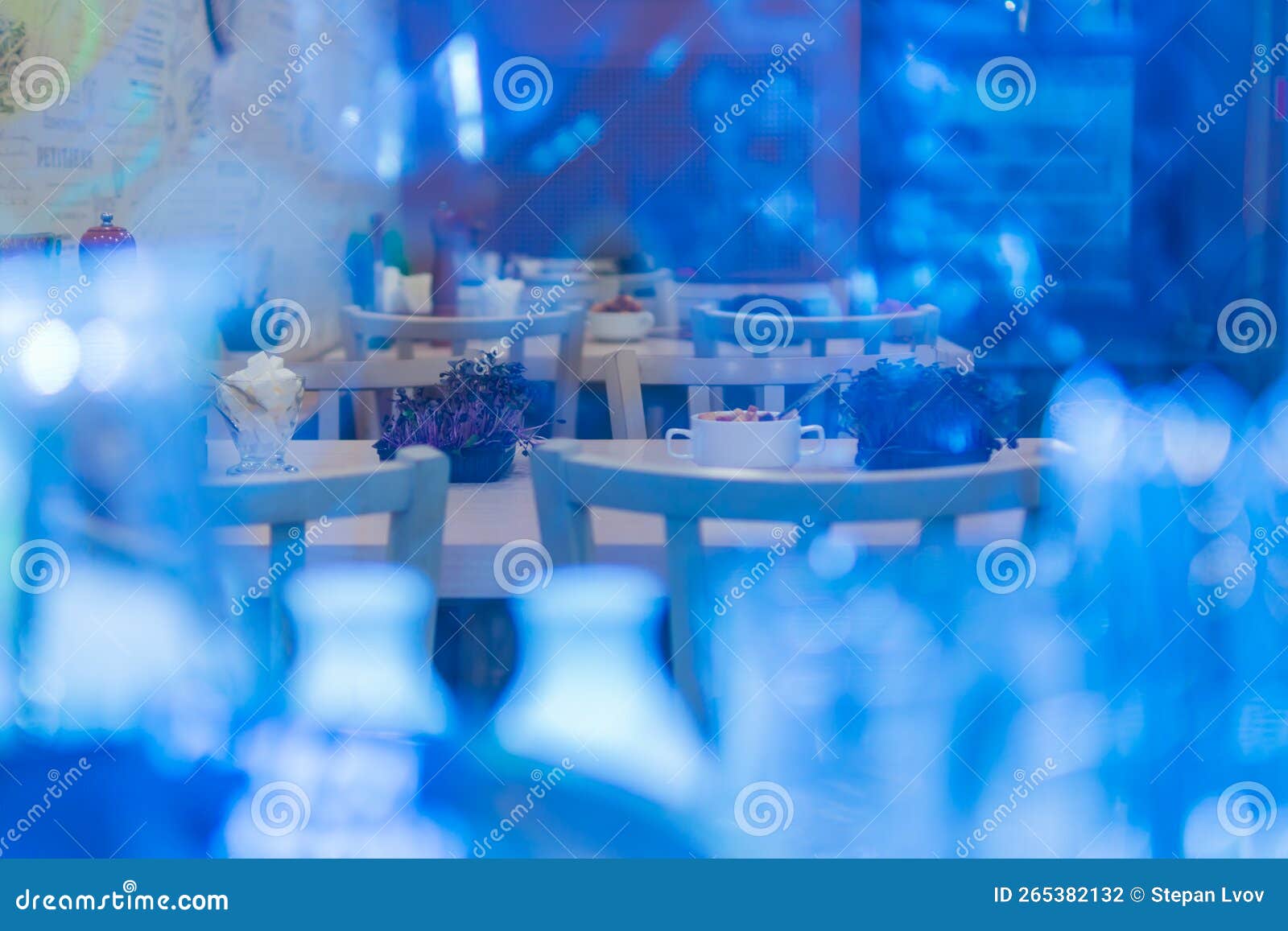 Cafe tables through glass stock photo. Image of blue 265382132
