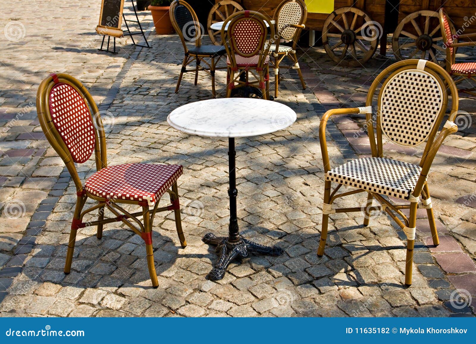 Cafe tables outdoors stock photo. Image of street, cafe 11635182