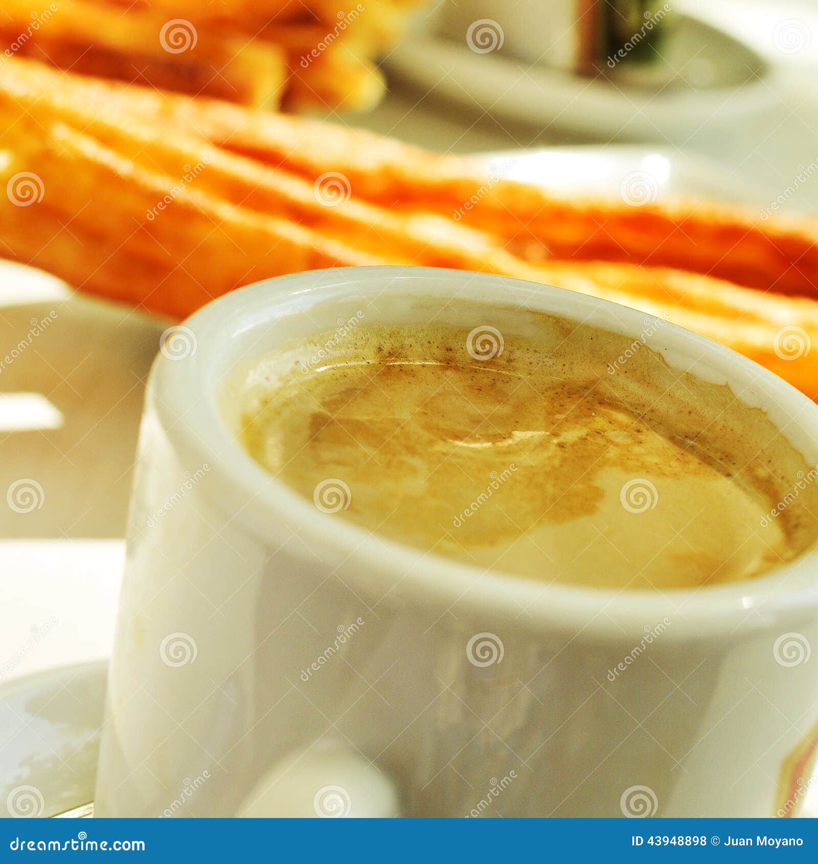 cafe y porras, coffee and thick churros, the typical breakfast i