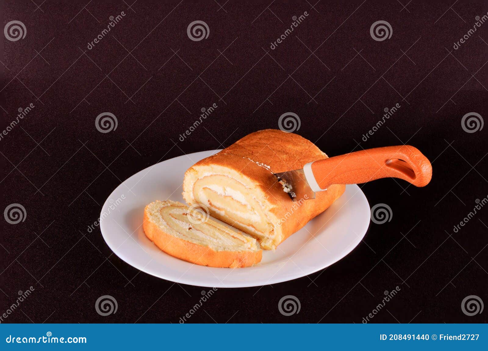 Cake with a Knife on a White Background Isolate Stock Photo - Image of