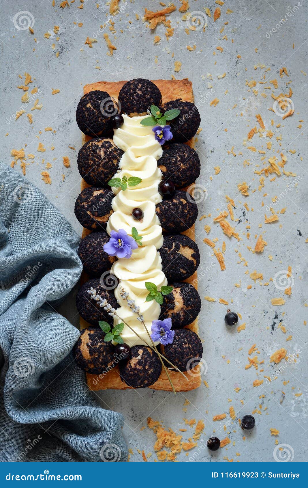 cake of saint-onore from puff pastry, profiteroles, currant cream and whipped cream. classic french dessert. an exquisite confecti