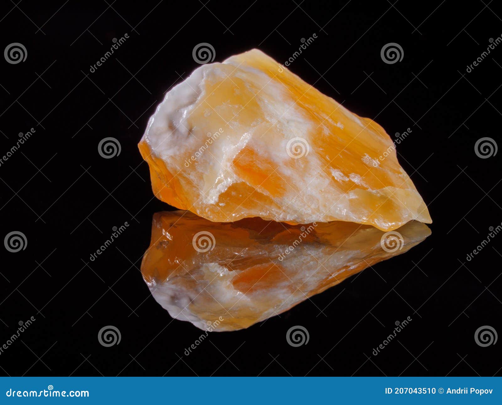 calcite orange close-up. black background. macro image.