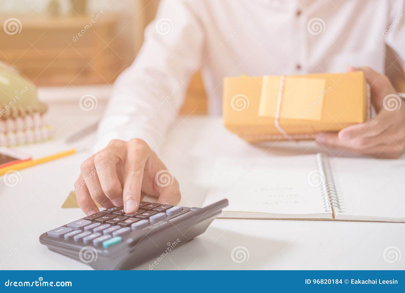 Calculating the Cost of Postage of a Small Package Stock Photo Image