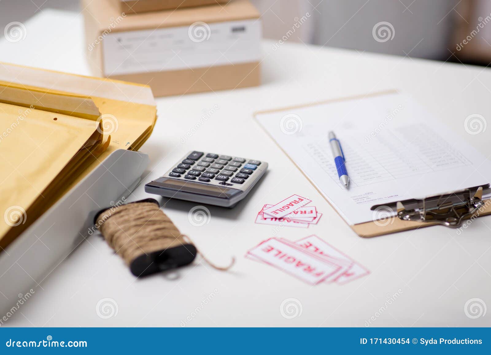 Calculator, Clipboard and Envelopes at Post Office Stock Photo Image