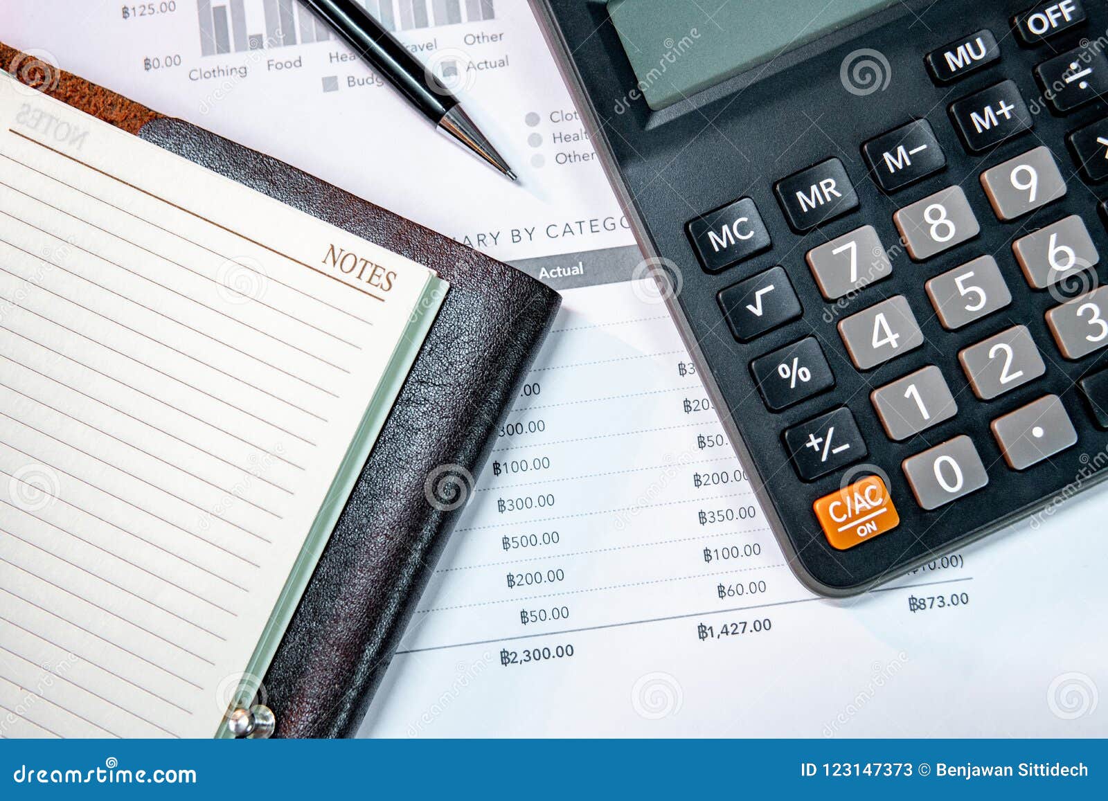 calculator notebook pen and summary report paper stock image notebook with graph and lined paper