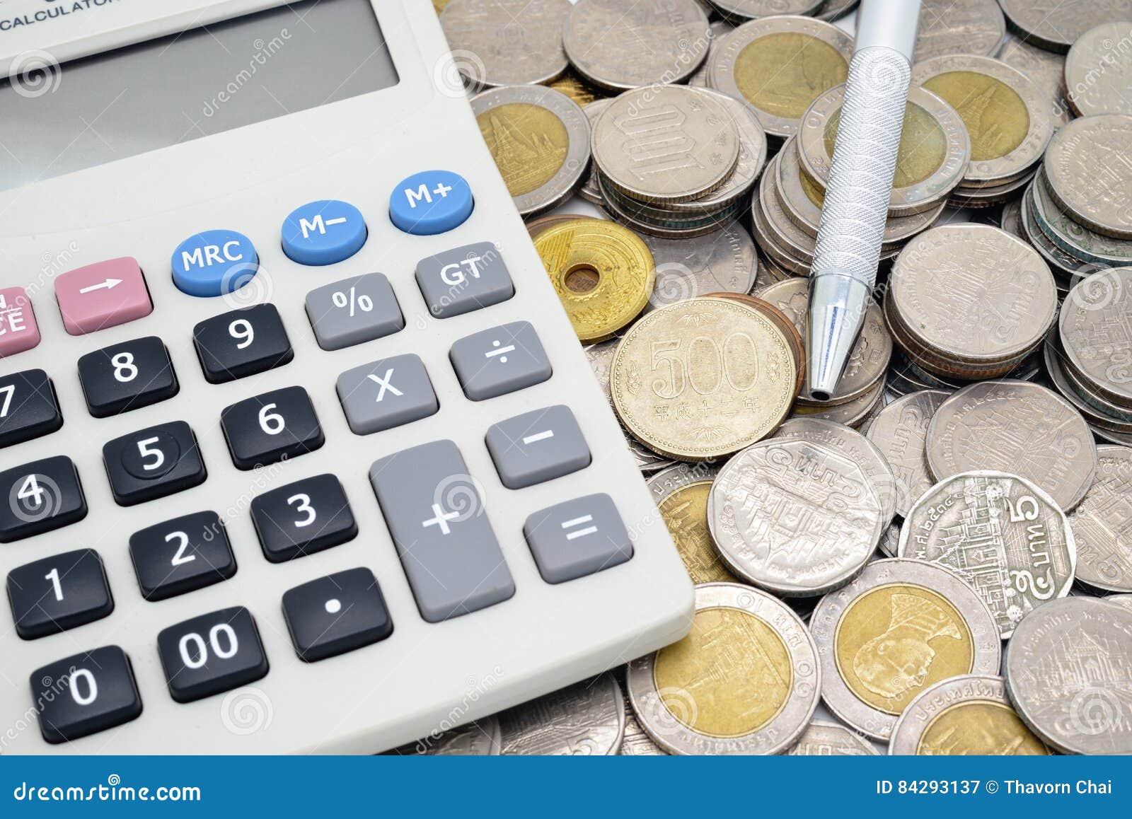Calculator with a Pen on Stack of Coins Stock Image Image of bronze