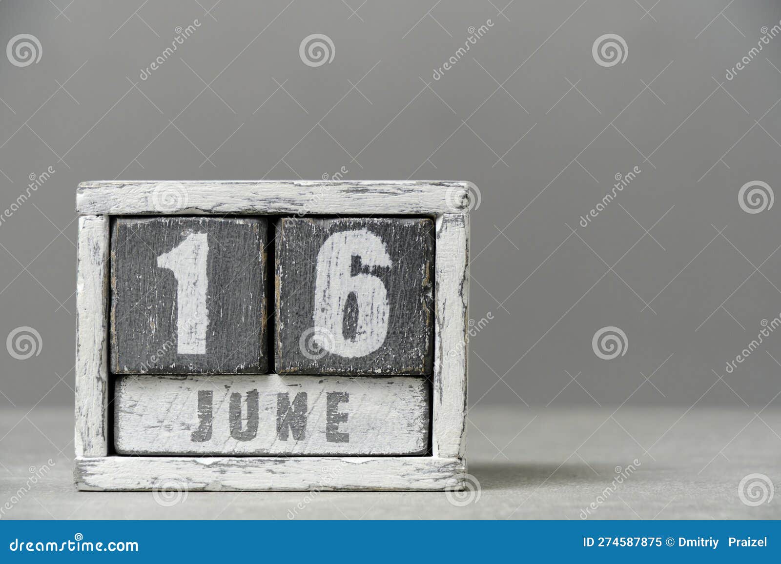 calendar for june 16, made wooden cubes, on gray background.with an empty space for your text.