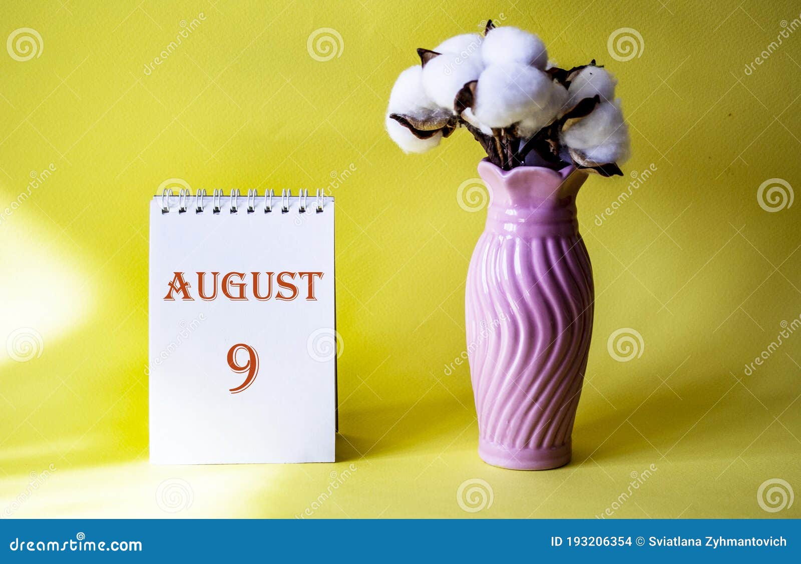 Calendar with Text 9 August and with a Vase of Flowers Stock Photo