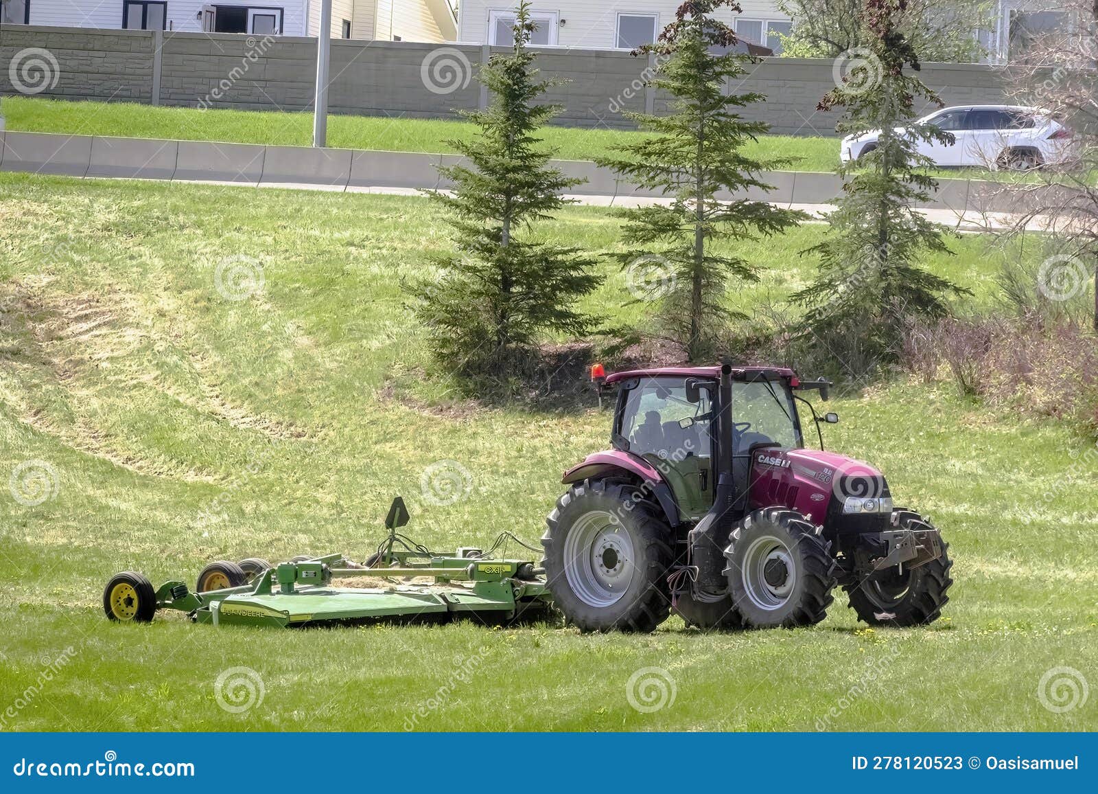Front View of a Tractor Mowing Grass during Spring Editorial Stock