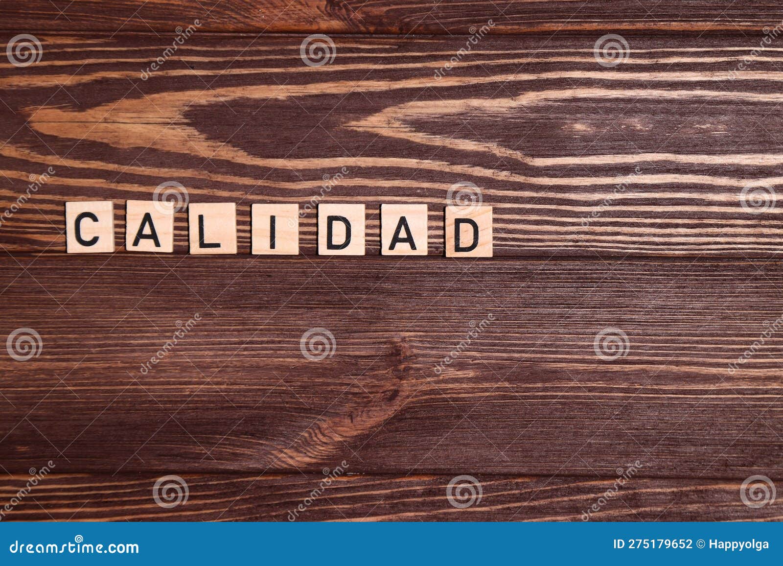 calidad, quality spanish word, lettering on wooden background