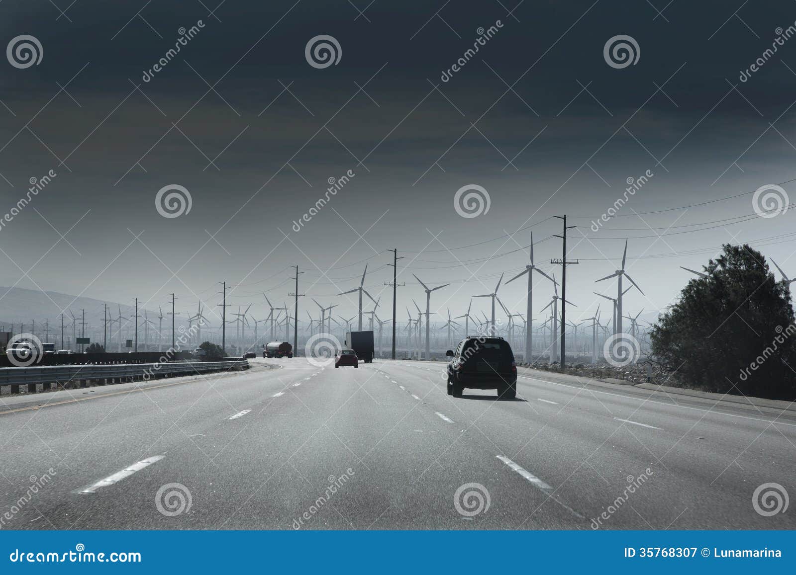 california road with electric windmills aerogenerators