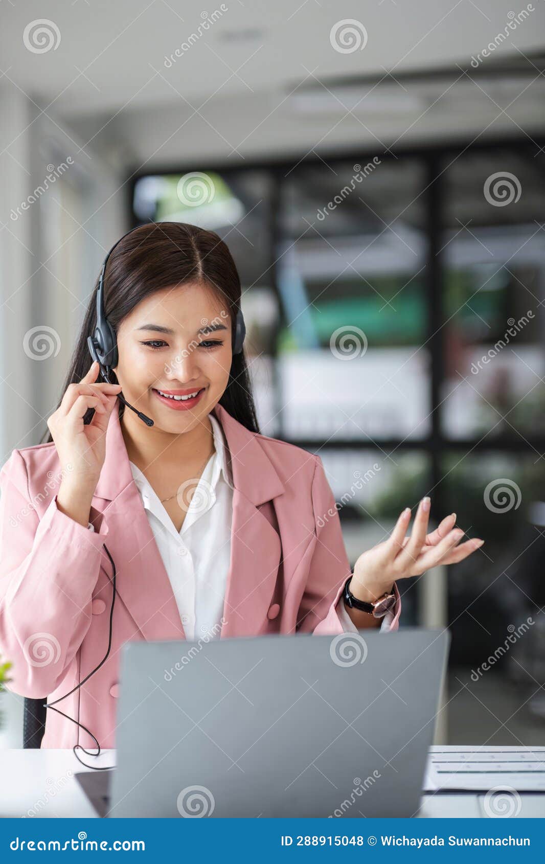 A Call Center Operator is Explaining Job Details To a Customer on a