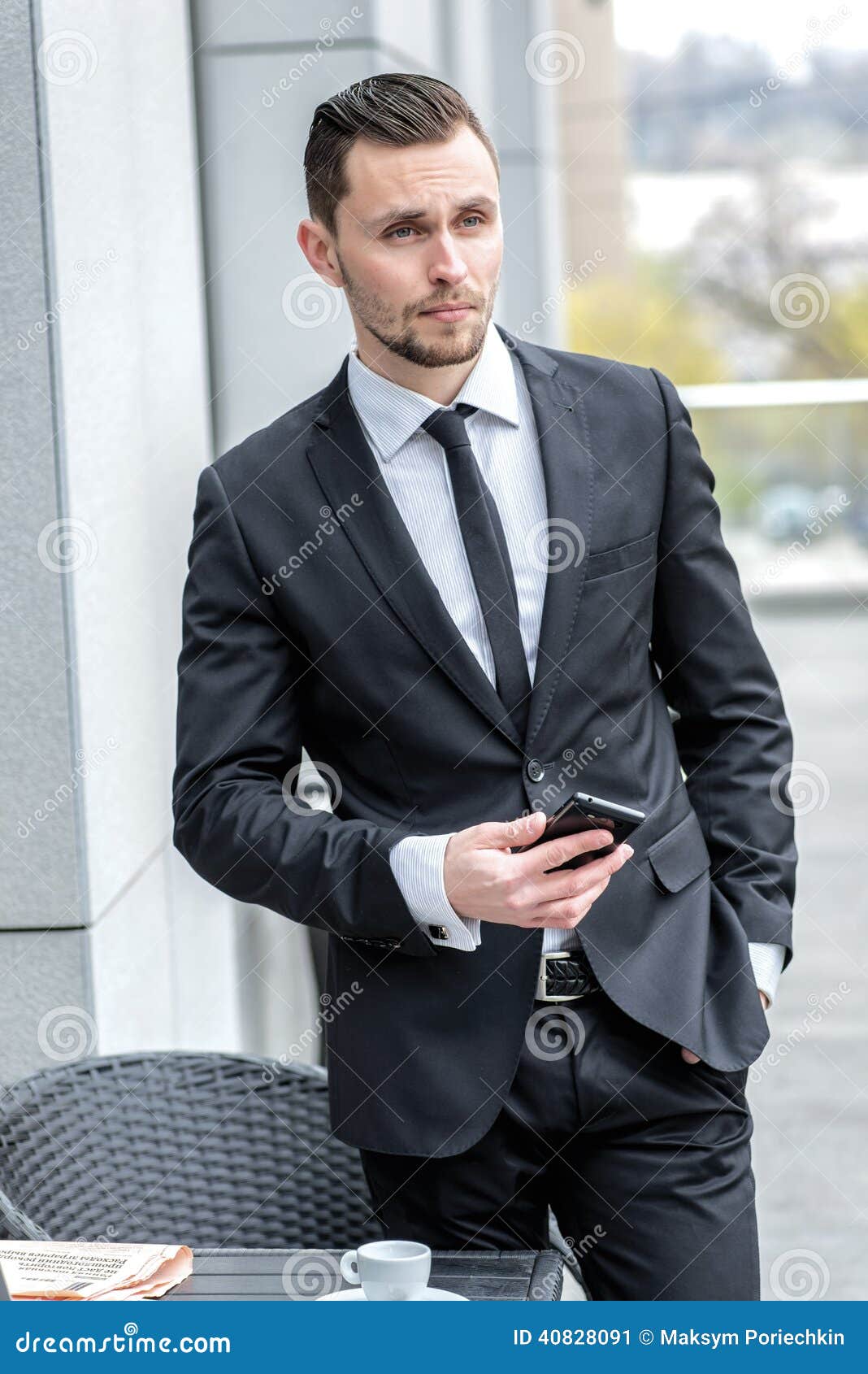 Call Waiting. Young Businessman in Formal Wear Holding a Cell Ph Stock ...