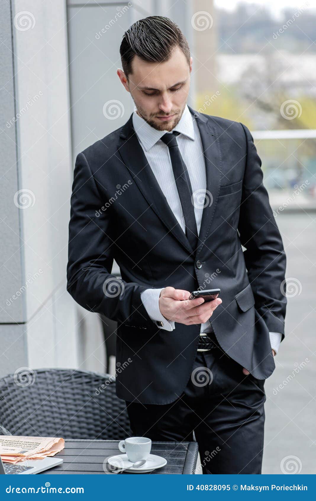 Call Waiting. Young Businessman in Formal Wear Holding a Cell Ph Stock ...