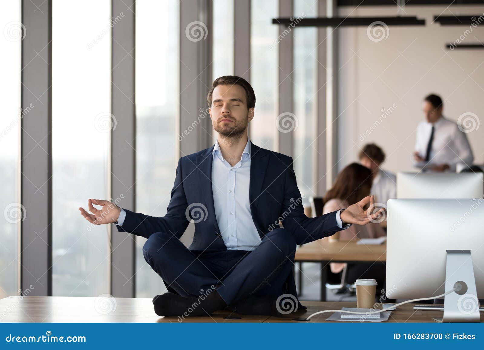 Calm Businessman Meditating On Office Desk Stress Relief Concept