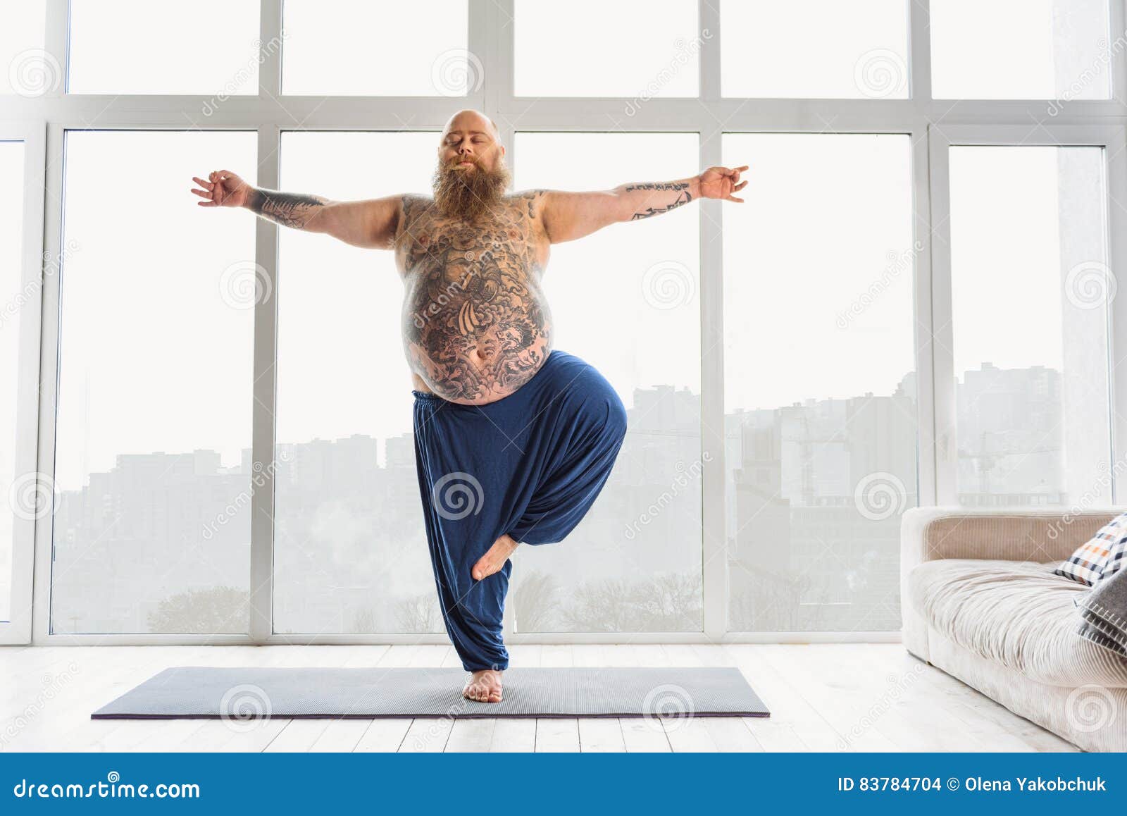 calm-fat-man-relaxing-meditation-relaxed-bearded-thick-guy-doing-yoga-home-standing-one-leg-stretching-83784704.jpg