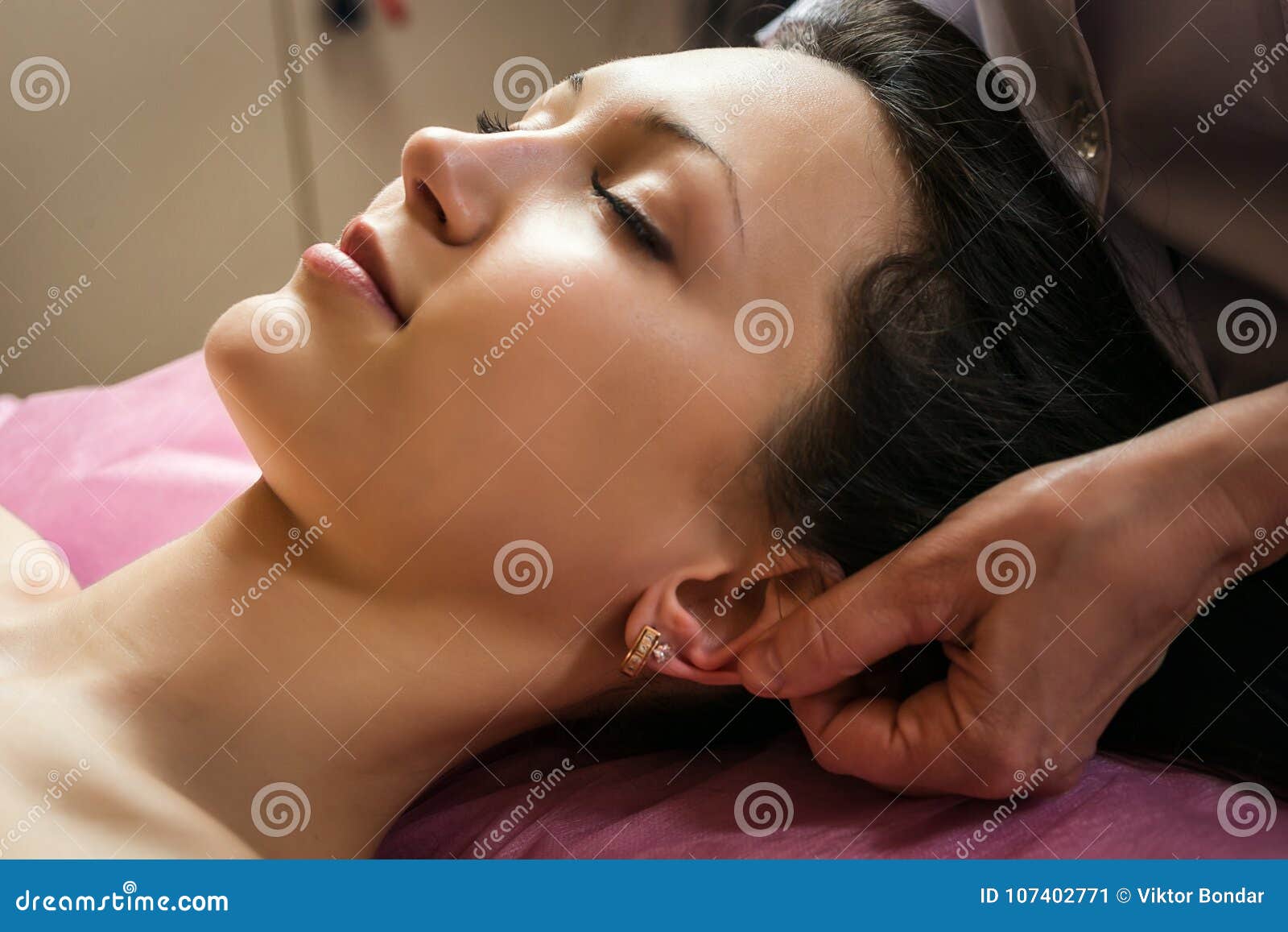 Calm Girl Having Spa Facial Massage In Luxurious Beauty Salon Stock