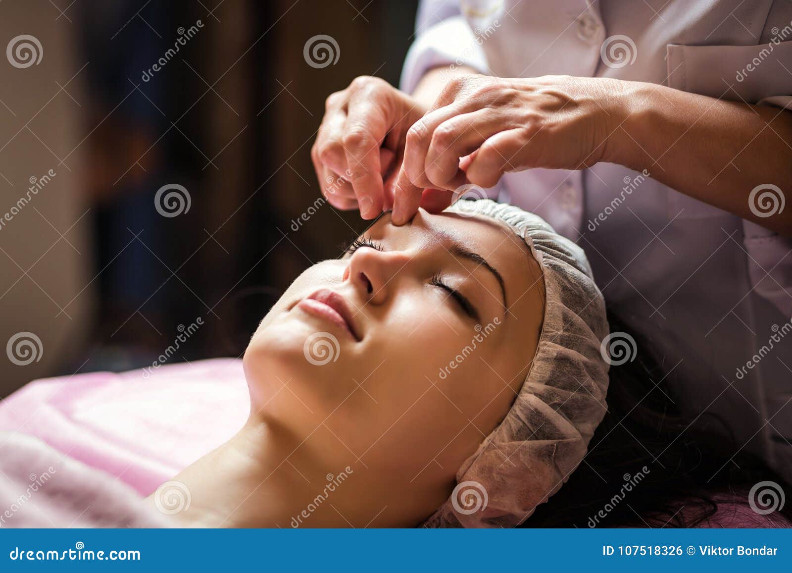 Calm Girl Having Spa Facial Massage In Luxurious Beauty Salon Stock