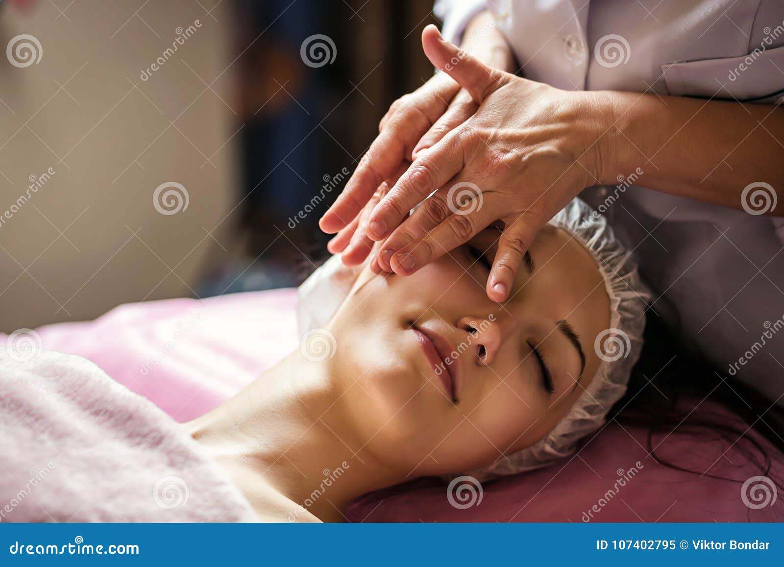 Calm Girl Having Spa Facial Massage In Luxurious Beauty Salon Stock