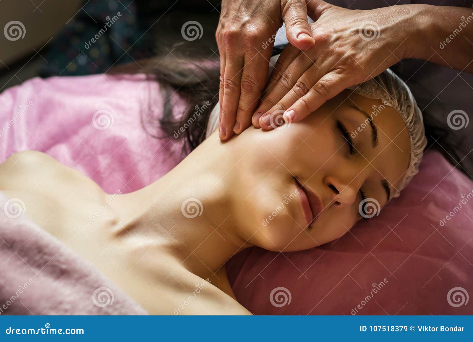 Calm Girl Having Spa Facial Massage In Luxurious Beauty Salon Stock