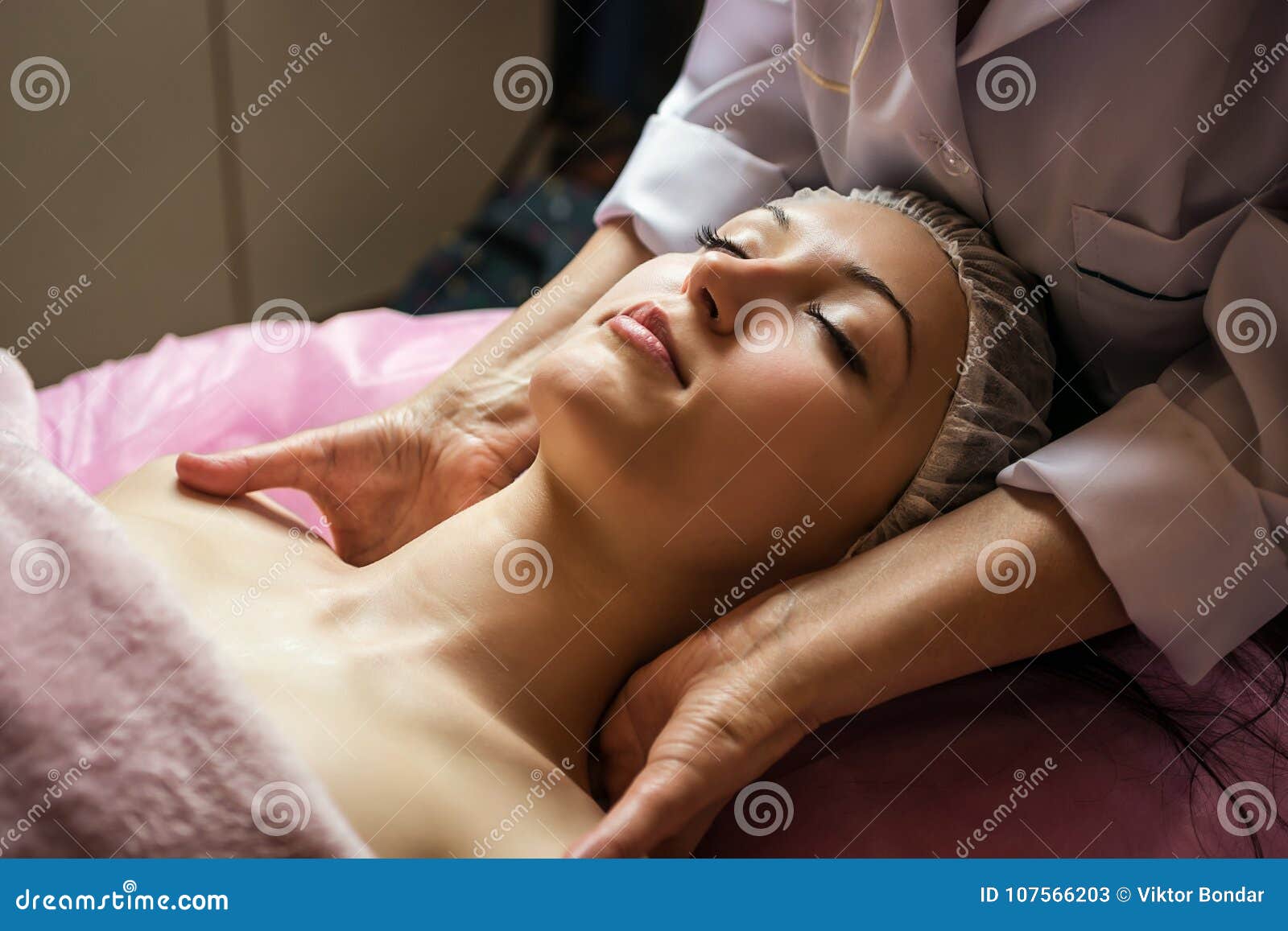 Calm Girl Having Spa Facial Massage In Luxurious Beauty Salon Stock