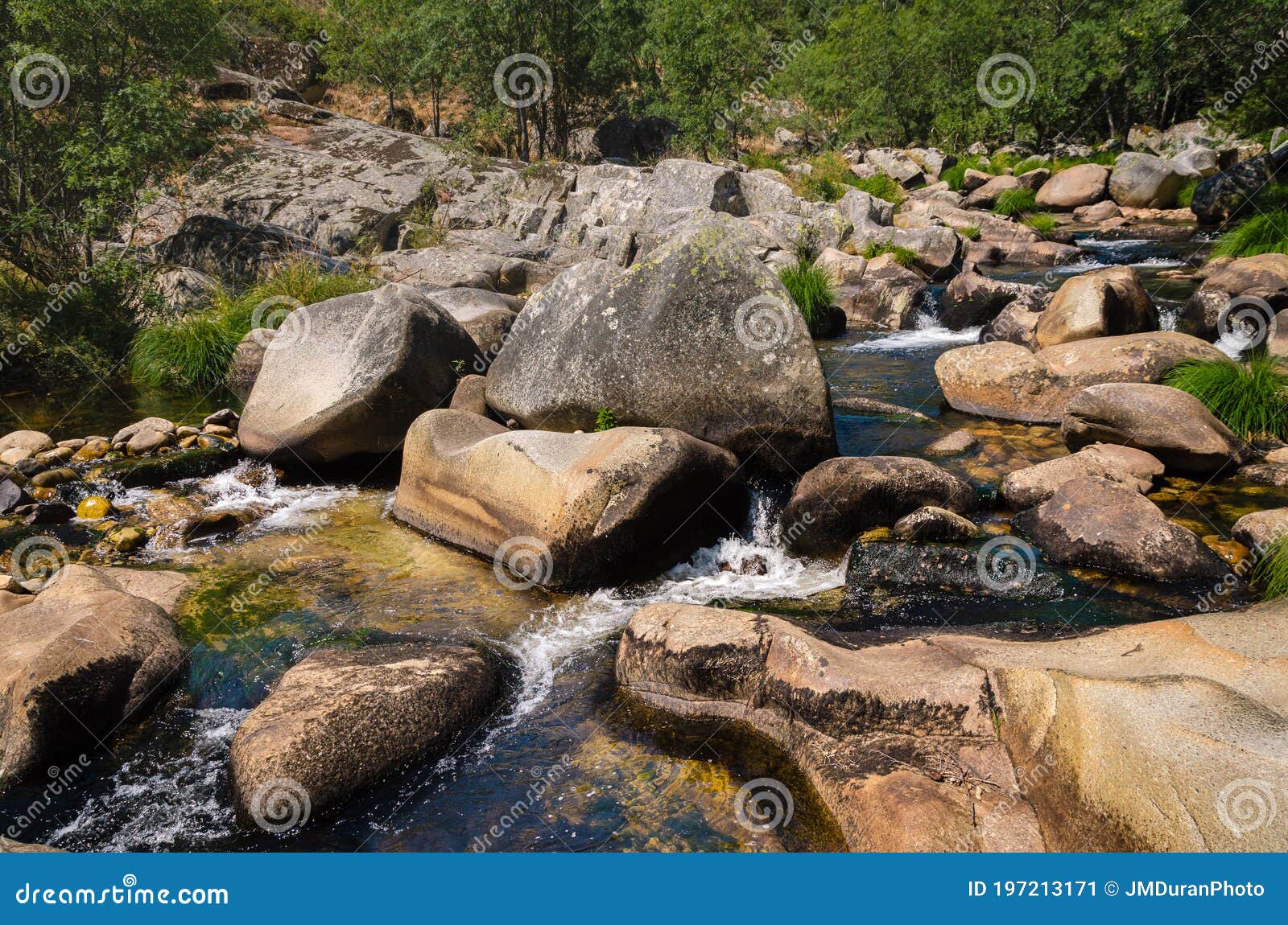 calm river flows forming small waterfalls, las batuecas natural park, salamanca, spain