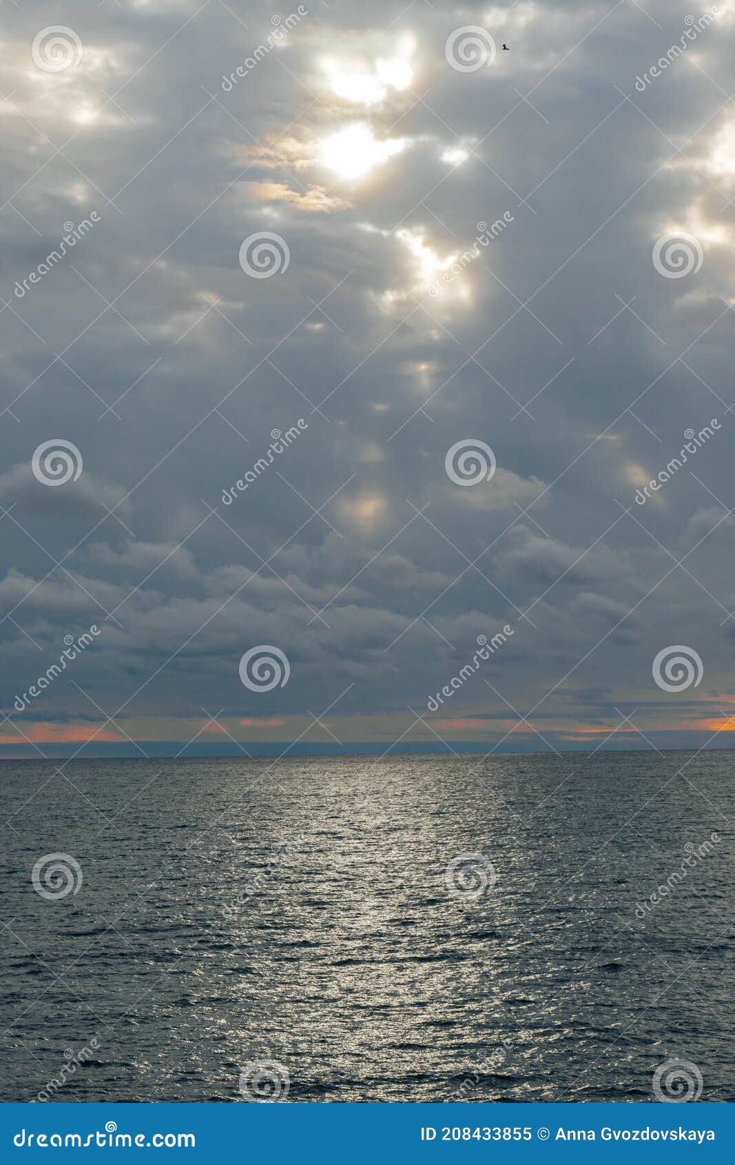Calm Sea and Blue Sky with White Cirrus Clouds. the Sun Shines through ...