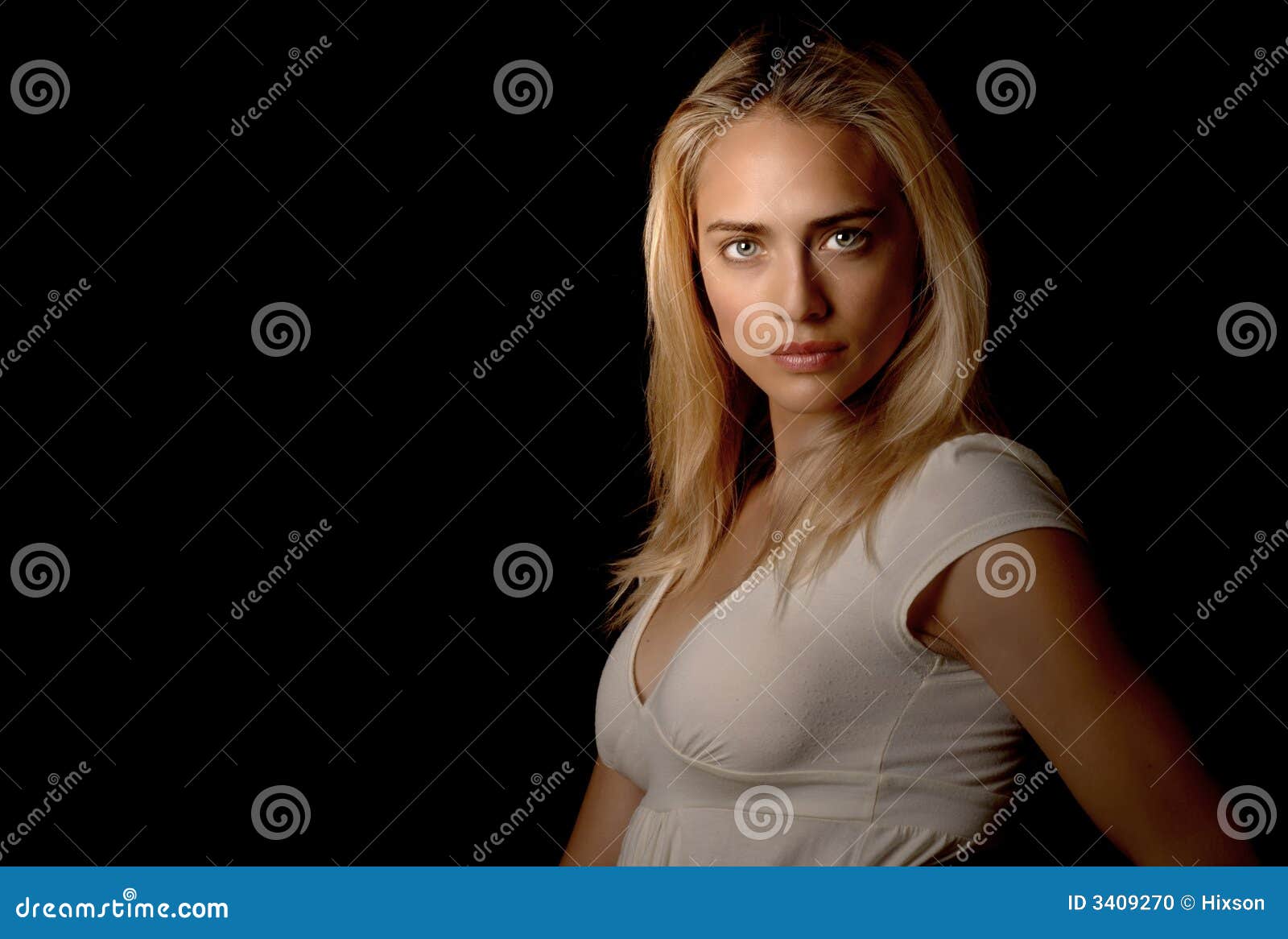 Beautiful blond model looking calm but strong portrait