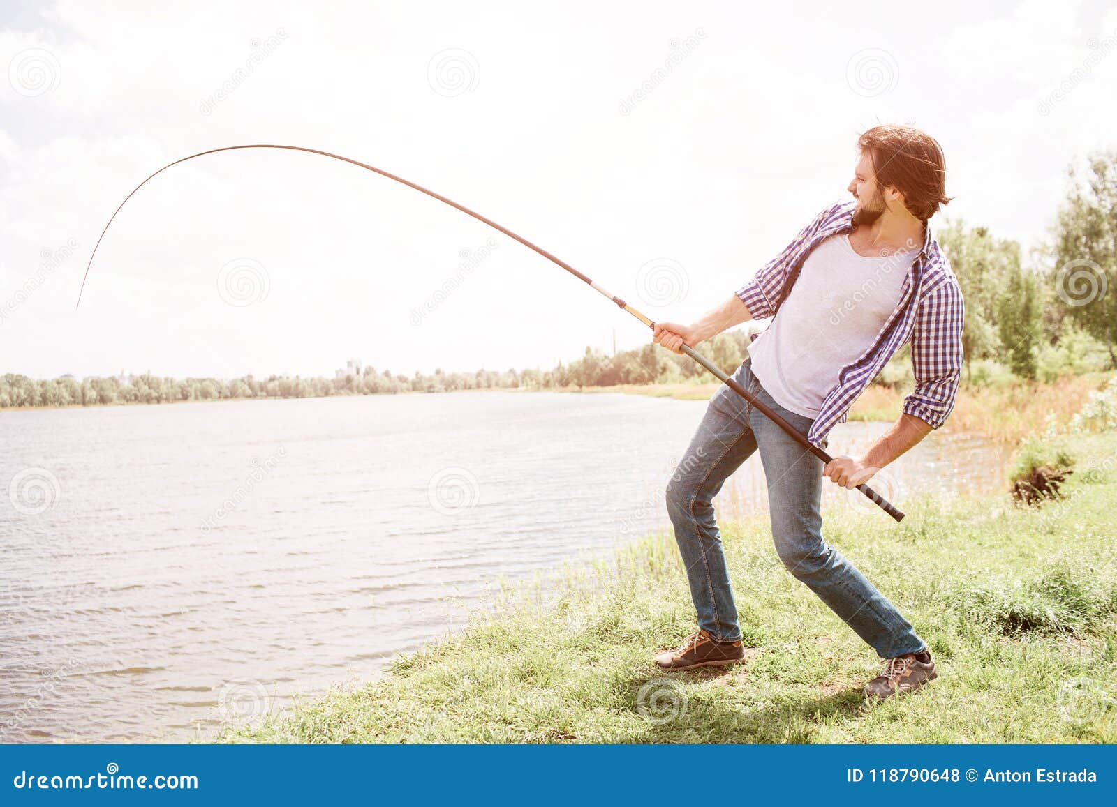 Calm and Thoughtful Guy is Standing at the Edge of Lake and Looking at it.  he is Holding Fish-rod on His Right Shoulder Stock Photo - Image of  cheerful, healthy: 118790648