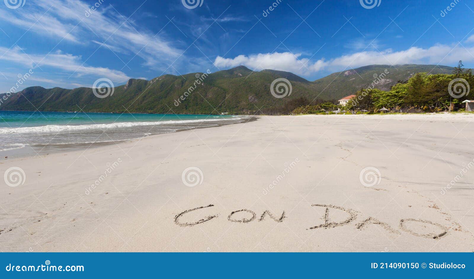 calm tropical beach with inscription con dao written on a sand