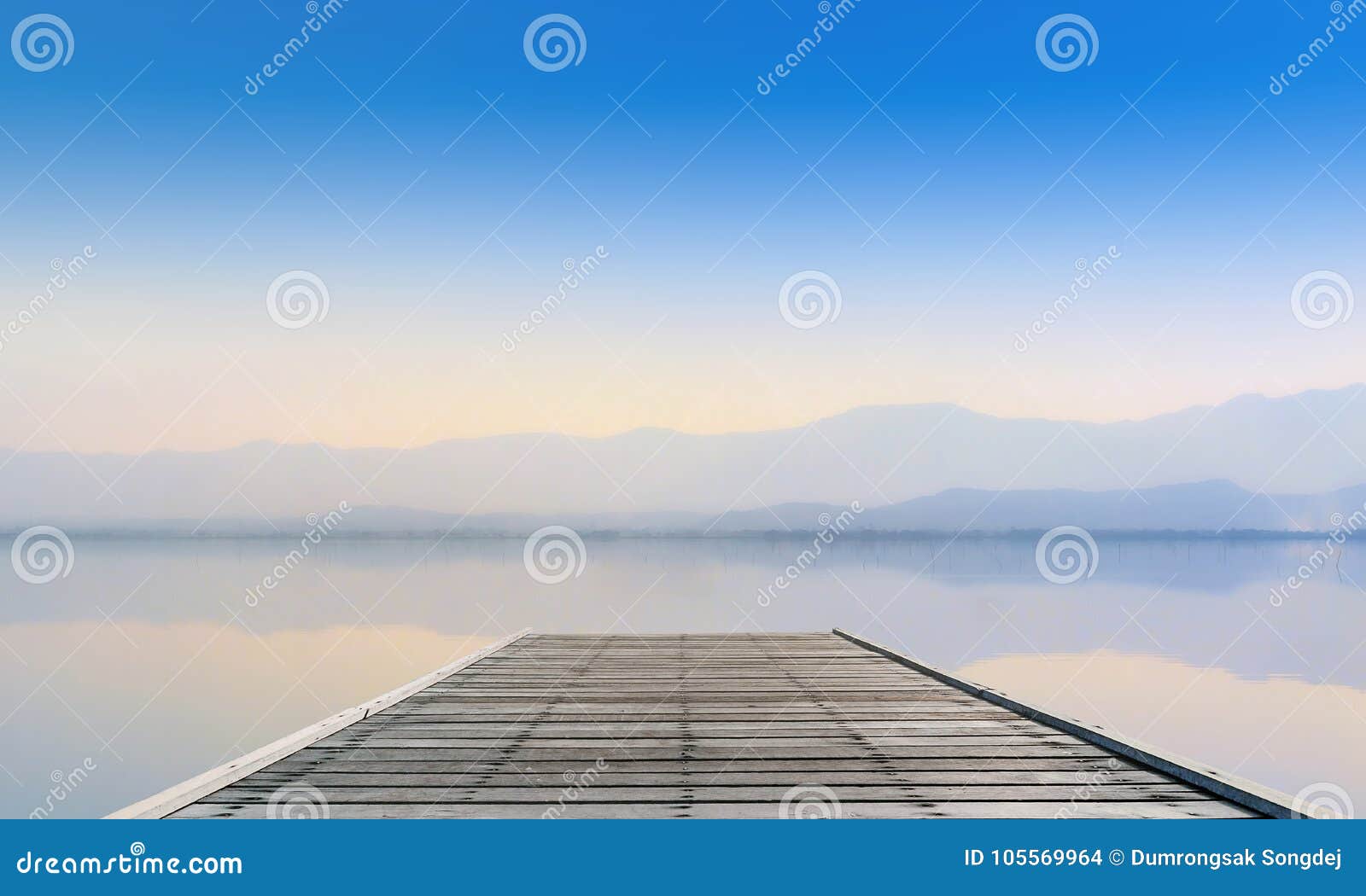 calmness lake with mountain in sunset