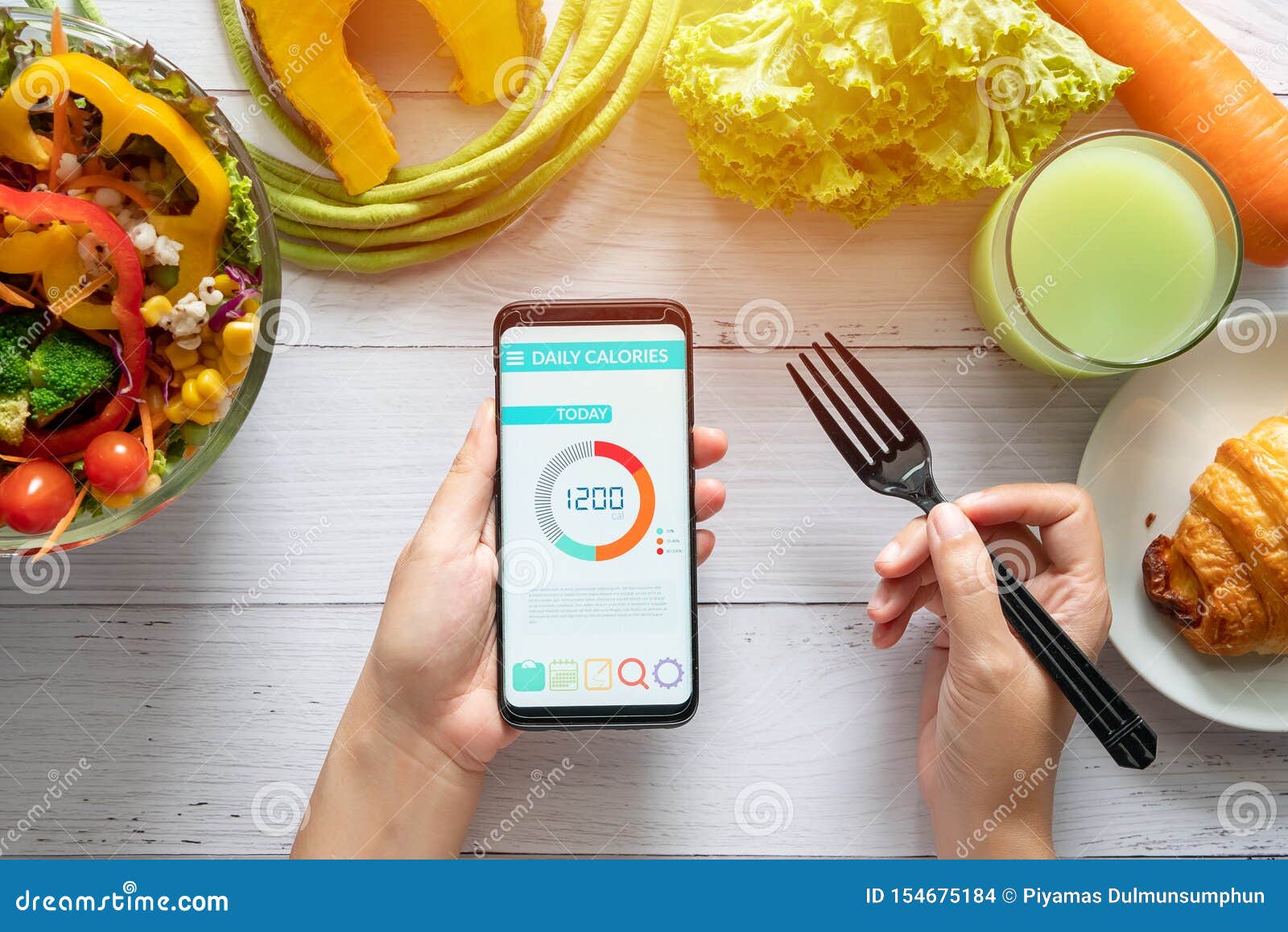 calories counting , diet , food control and weight loss concept. woman using calorie counter application on her smartphone