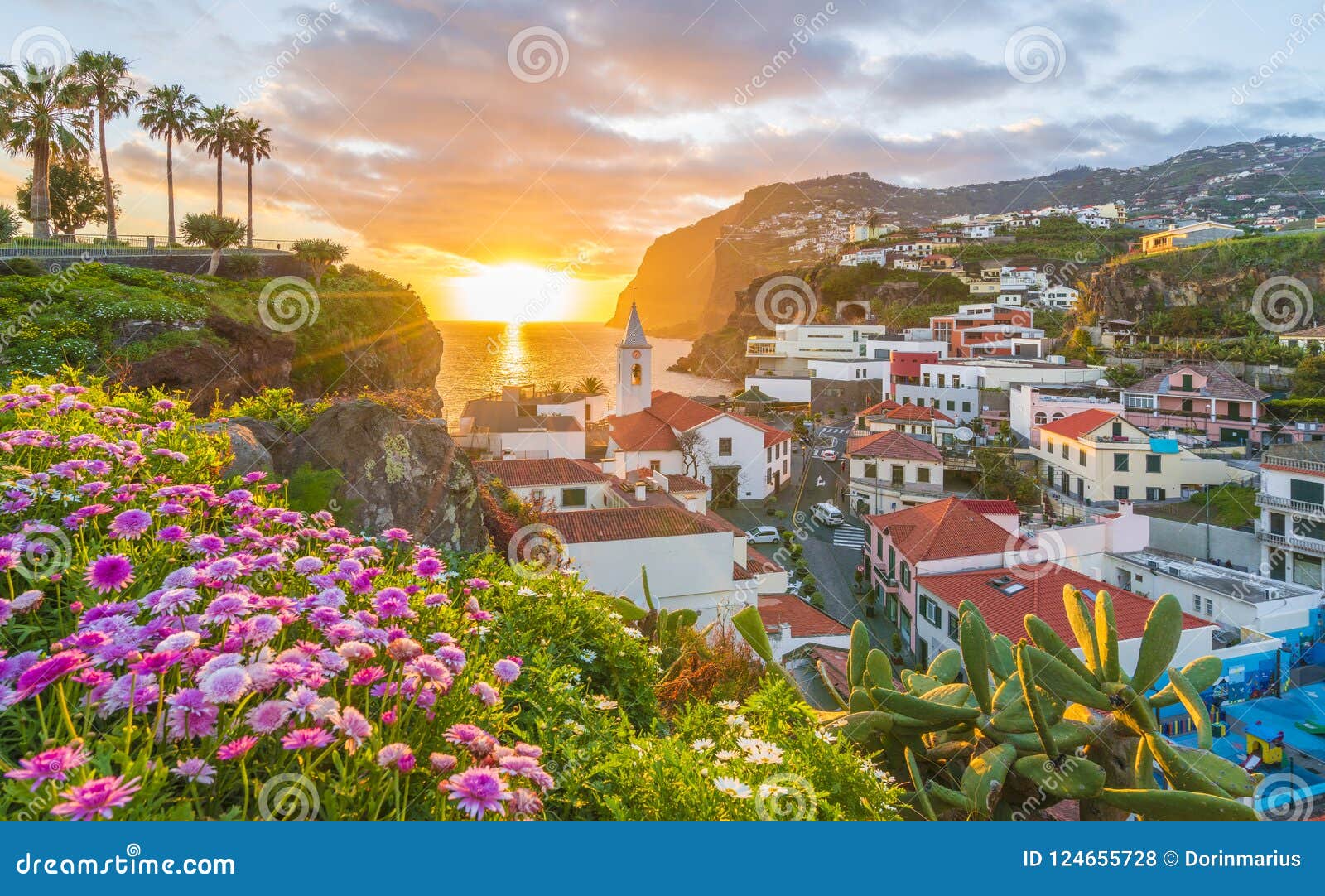 camara de lobos village at sunset, cabo girao in background, madeira island, portugal