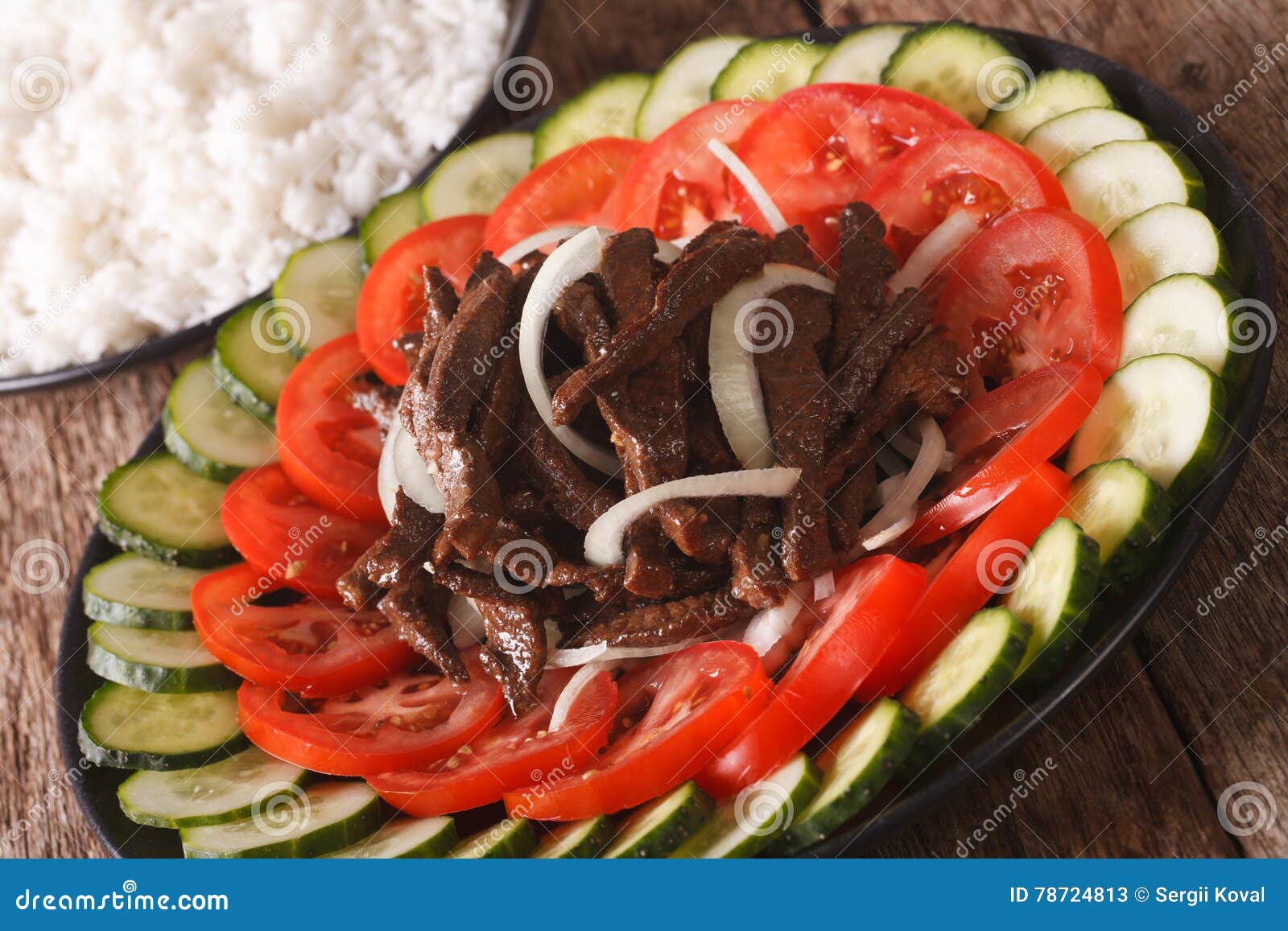 Cambodian Beef Lok Lak with Fresh Vegetables and a Side Dish of Stock
