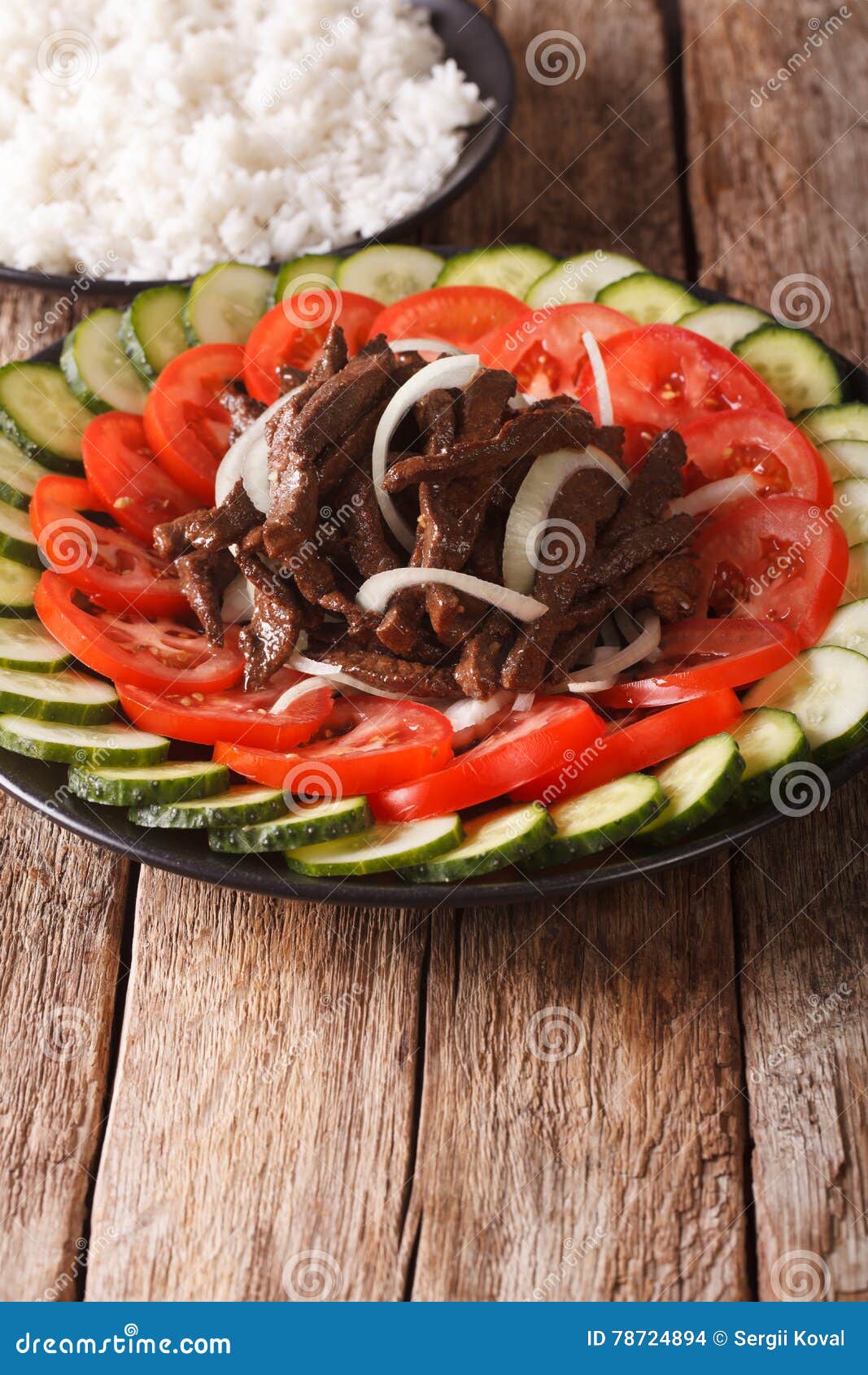 Cambodian Beef Lok Lak with Fresh Vegetables and a Side Dish of Stock
