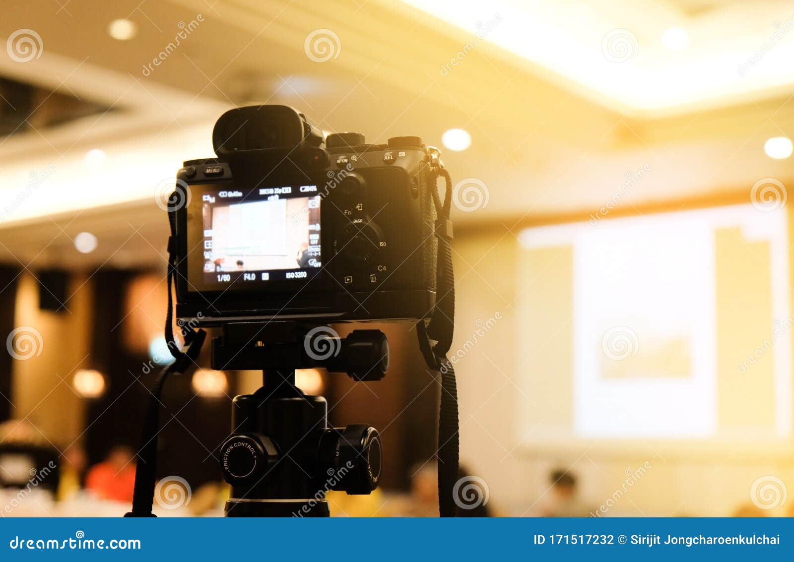 Camera in Business Conference Room Recording Participants and Speaker
