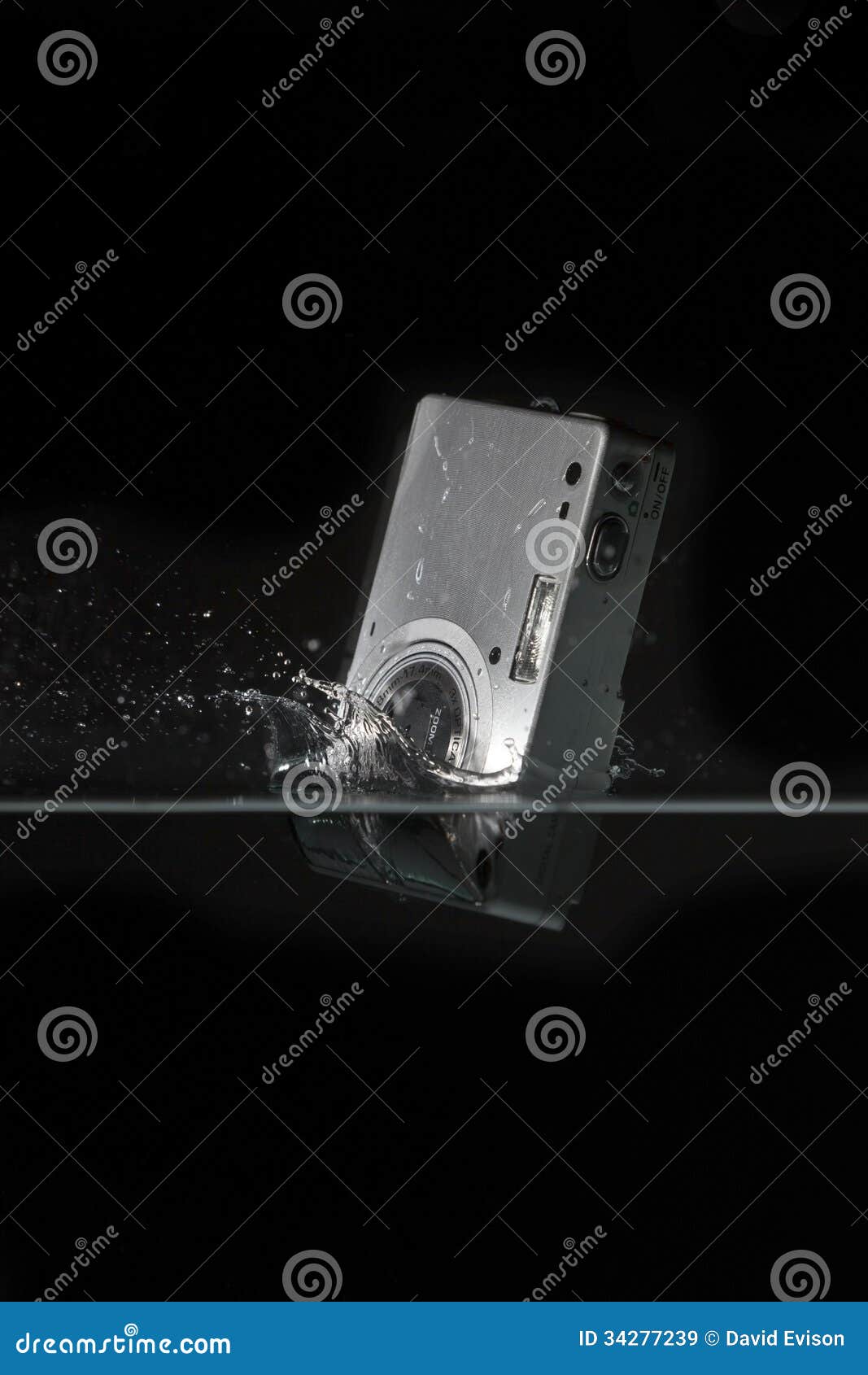 Camera dropped into water. stock image. Image of fall 34277239