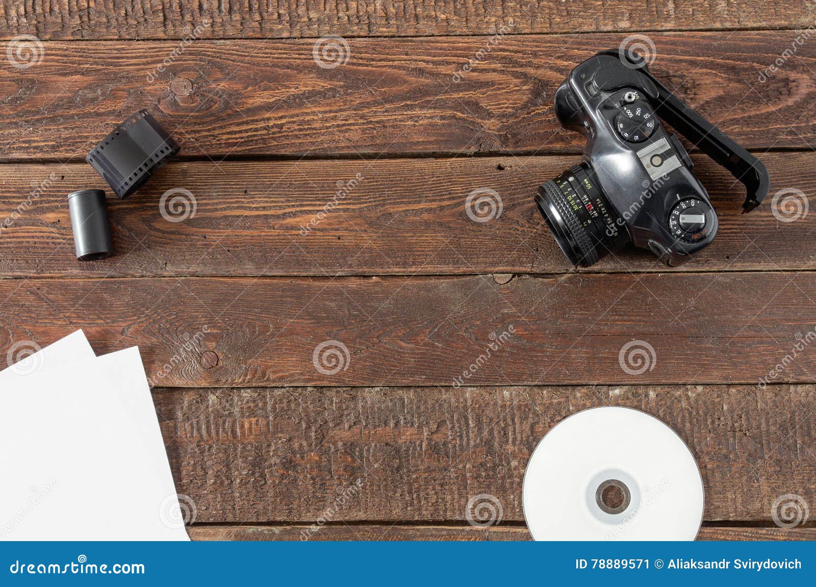 Camera, Films, Paper and Cd on Wood Table Stock Image Image of