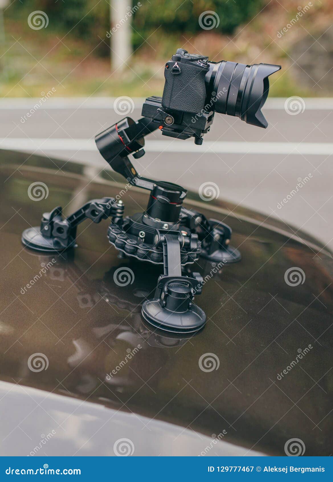 Camera Gimbal on the Car Steadicam Keeps on Suckers on the Auto Car