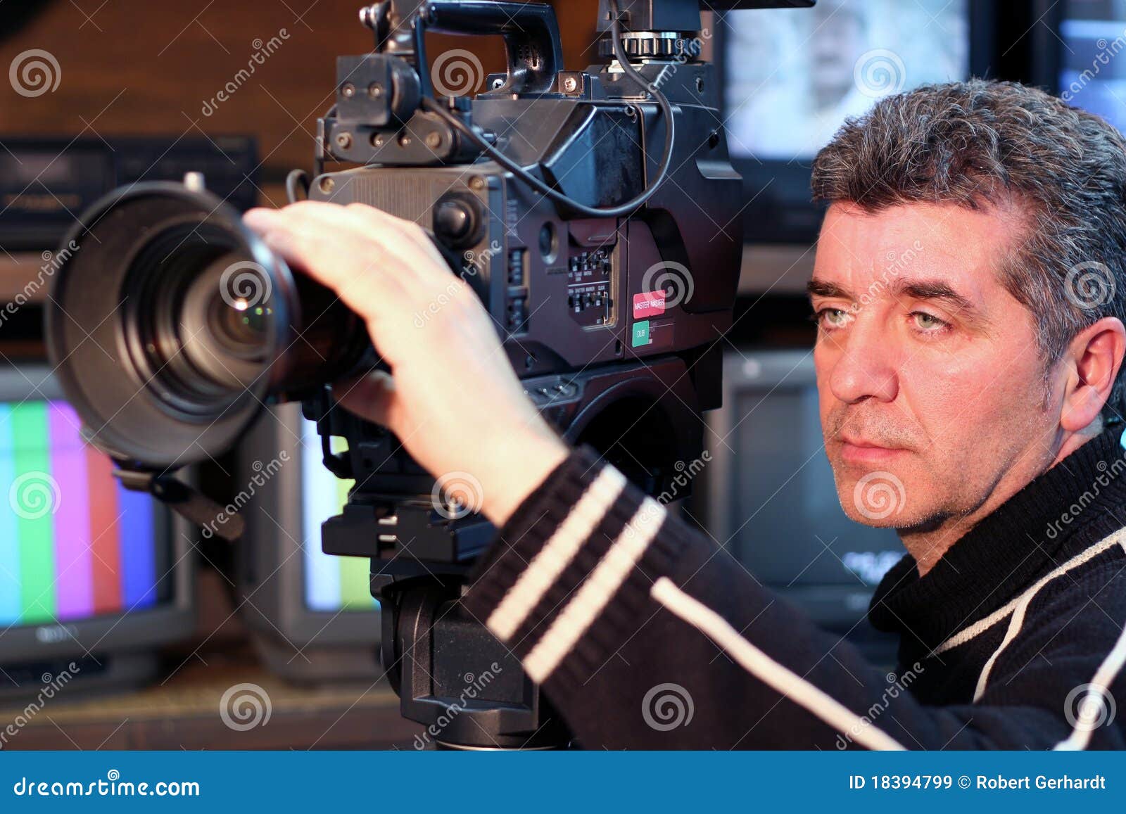 Camera operator using a television camera. Canon EOS 550D.