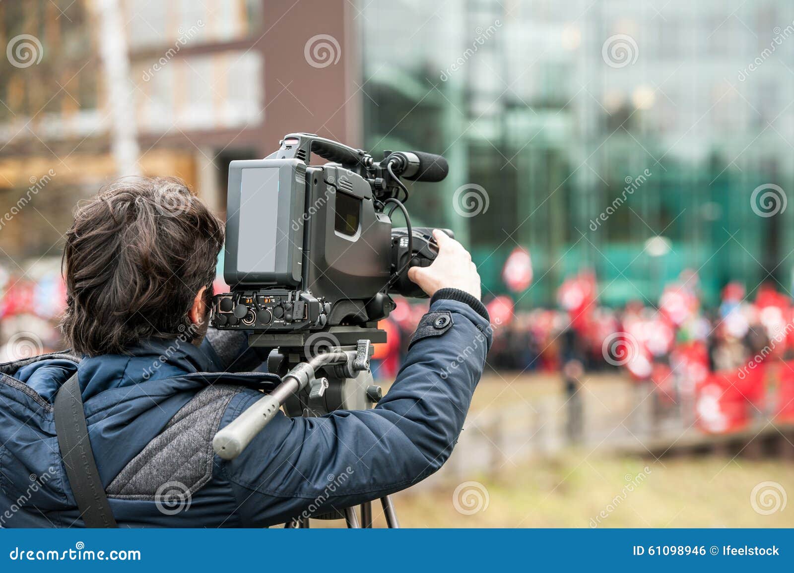 camera operator working outside during breaking news live event