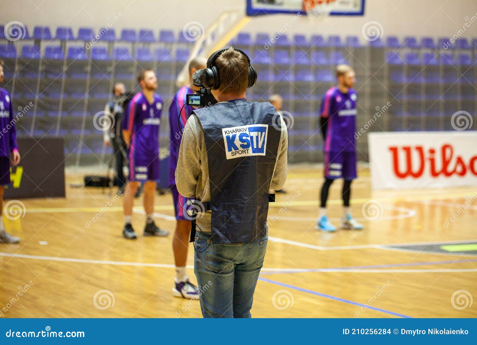 Cameraman with High Definition Video System and Headphone Recording Live Stream during Basketball Match of Ukrainian Superleage Editorial Stock Image