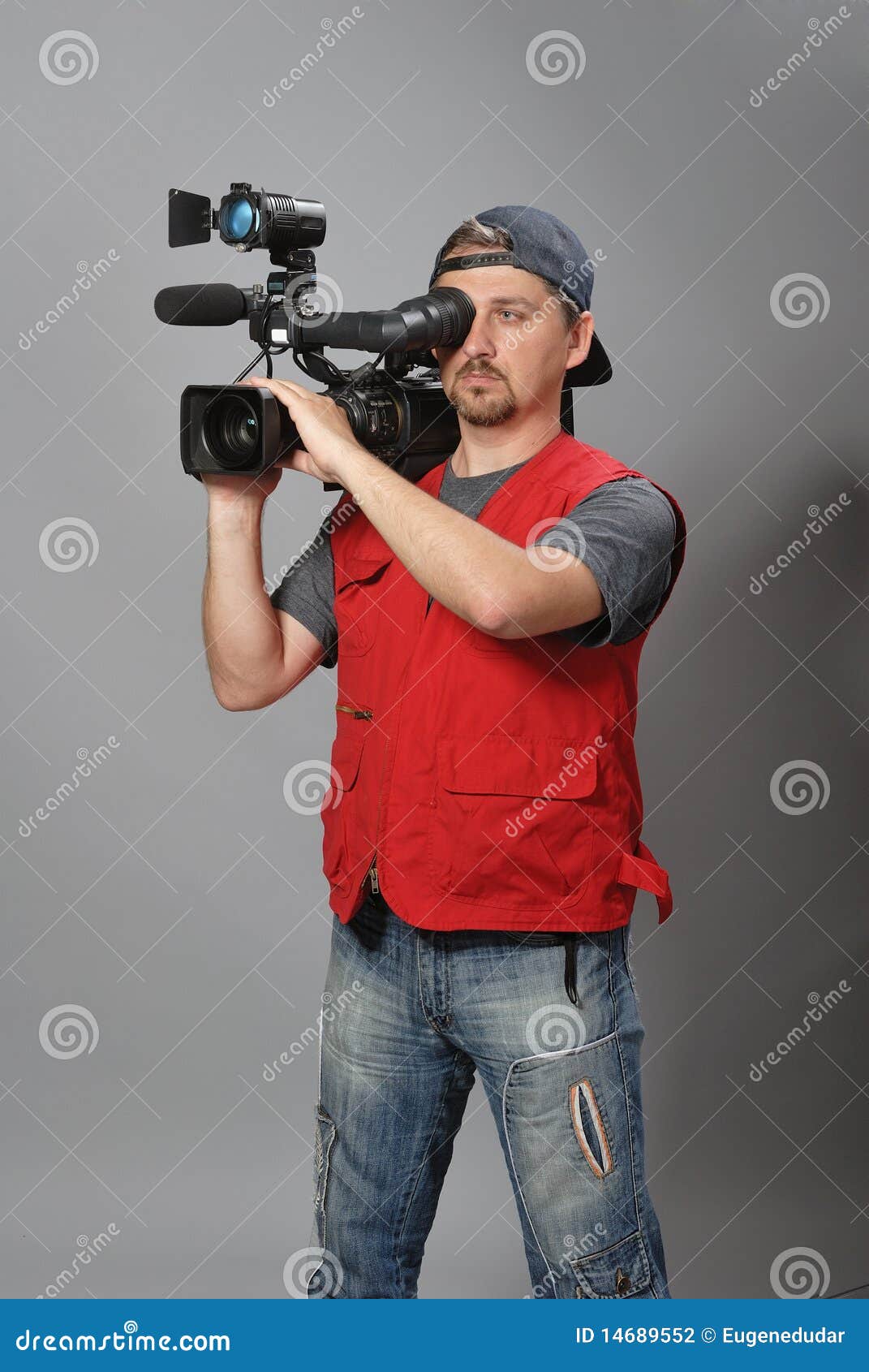 Cameraman in red vest stock photo. Image of microphone 14689552
