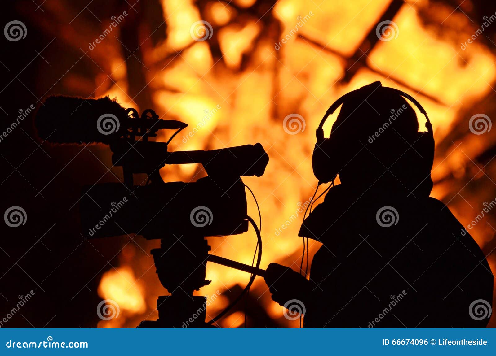 cameraman reporter journalist filming building on fire flames