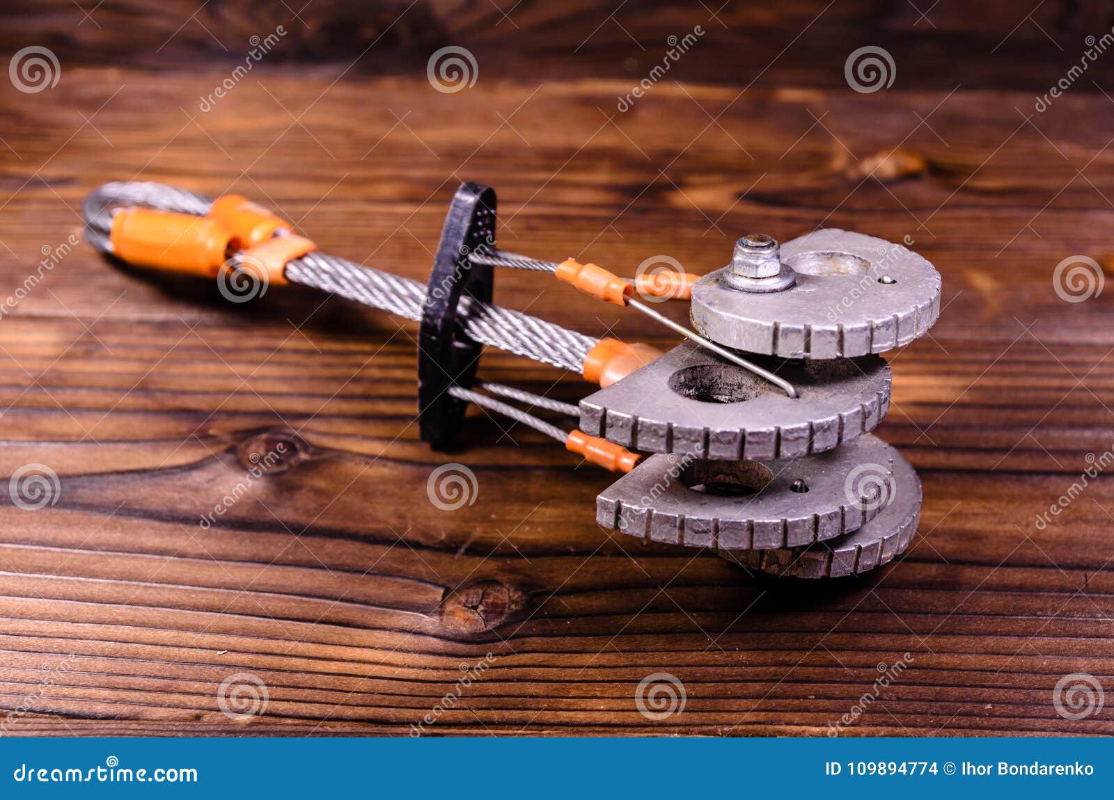 camming device friend for rock climbing on wooden table